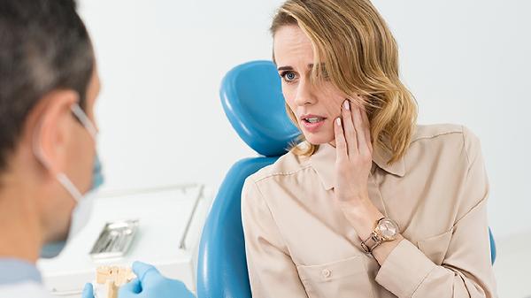 镶牙要磨掉2个邻牙吗